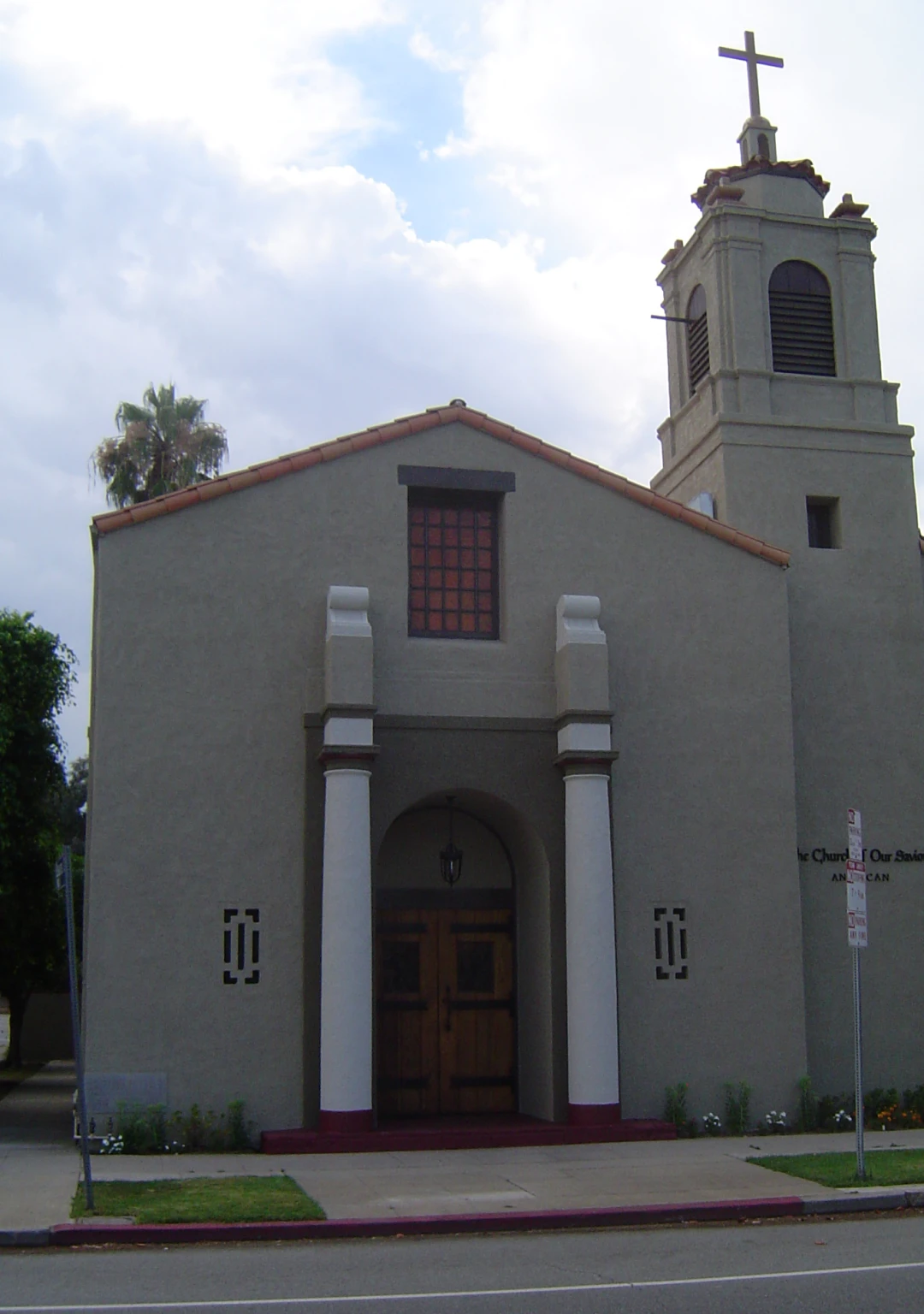 Church with bell tower and cross