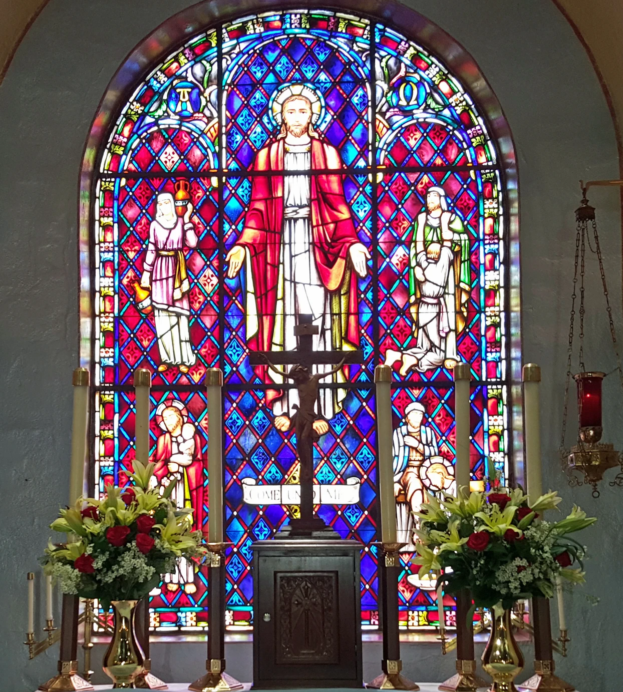 Stained glass window with religious figures